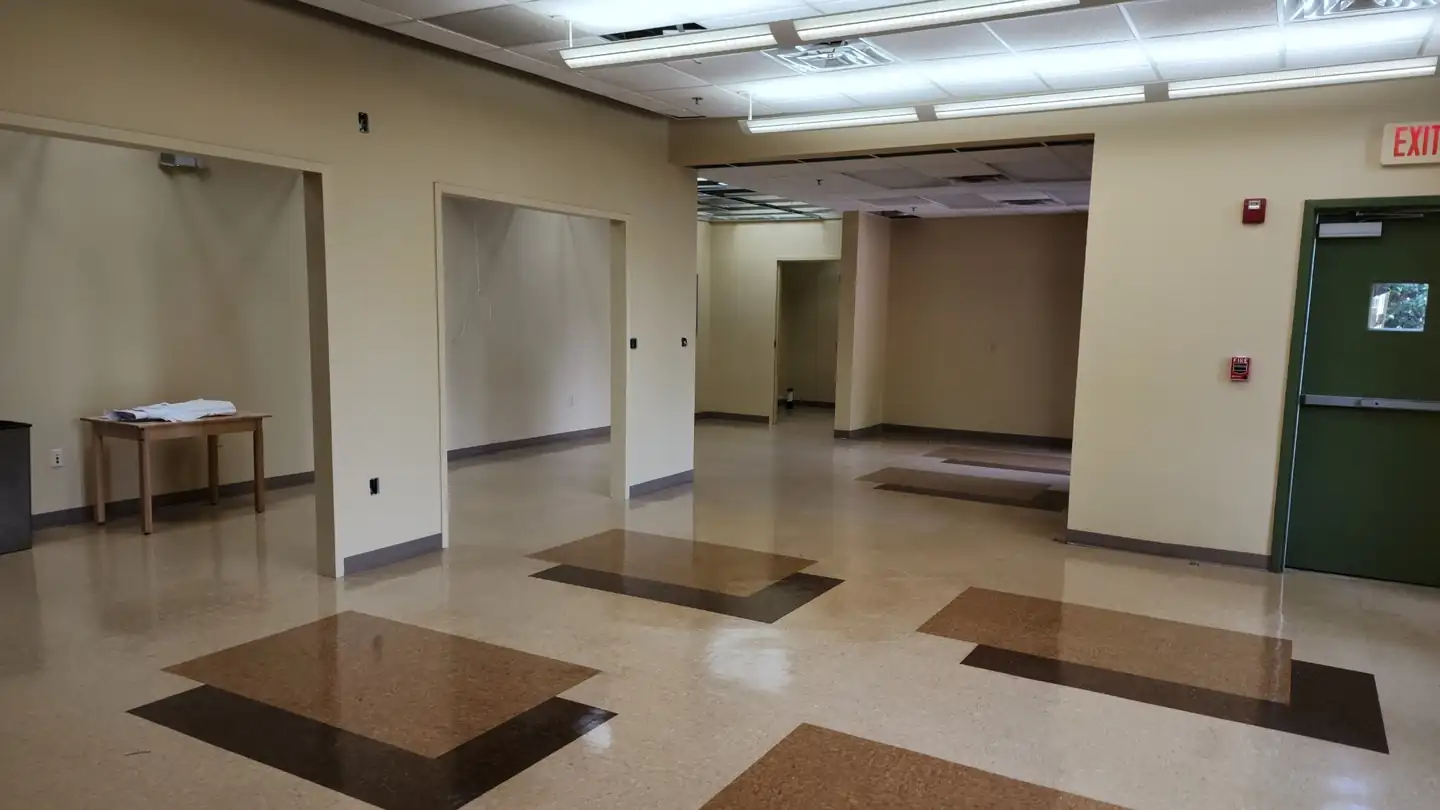 A commercial interior stripped back to structure during an upfit