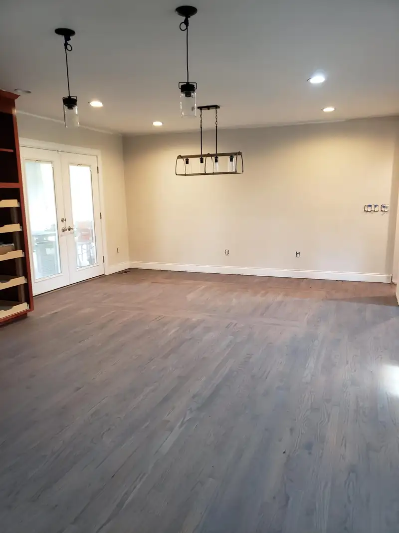 A restored room with new wide-plank flooring