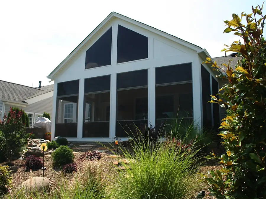 A screened porch addition seen from the garden